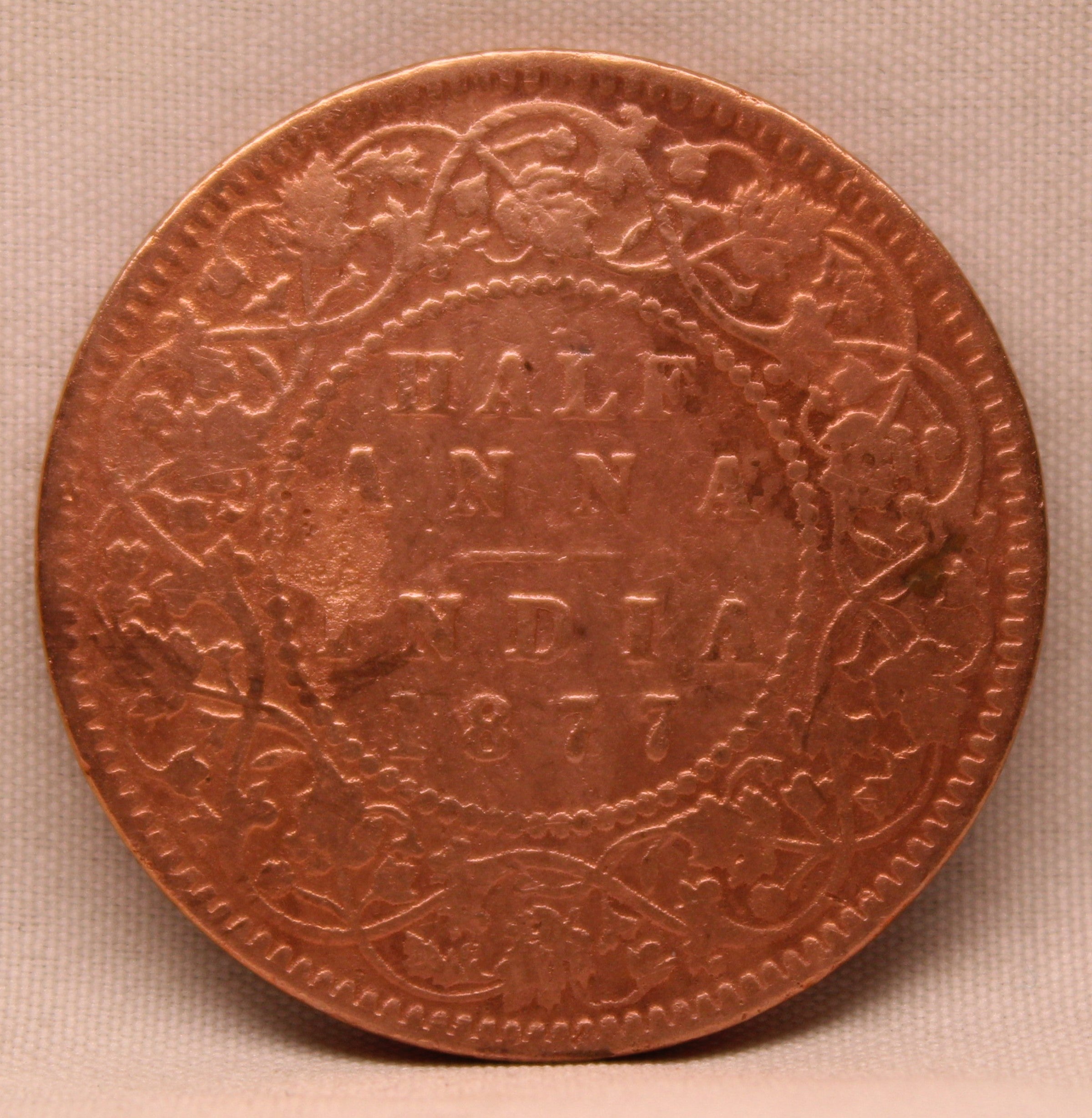 Half Anna  Coin of Victoria Empress of Calcutta Mint of 1877 Copper